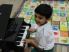 Little fingers playing notes on Piano
